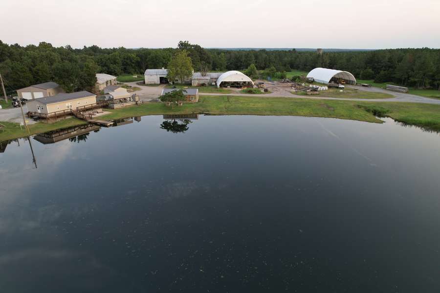 41 Acres with Home, Stocked Pond, Solar & Massive Storage Buildings