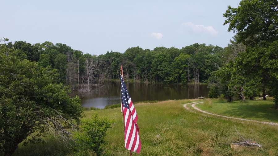 23.4 acres Next to the Garden of the Gods-with pond