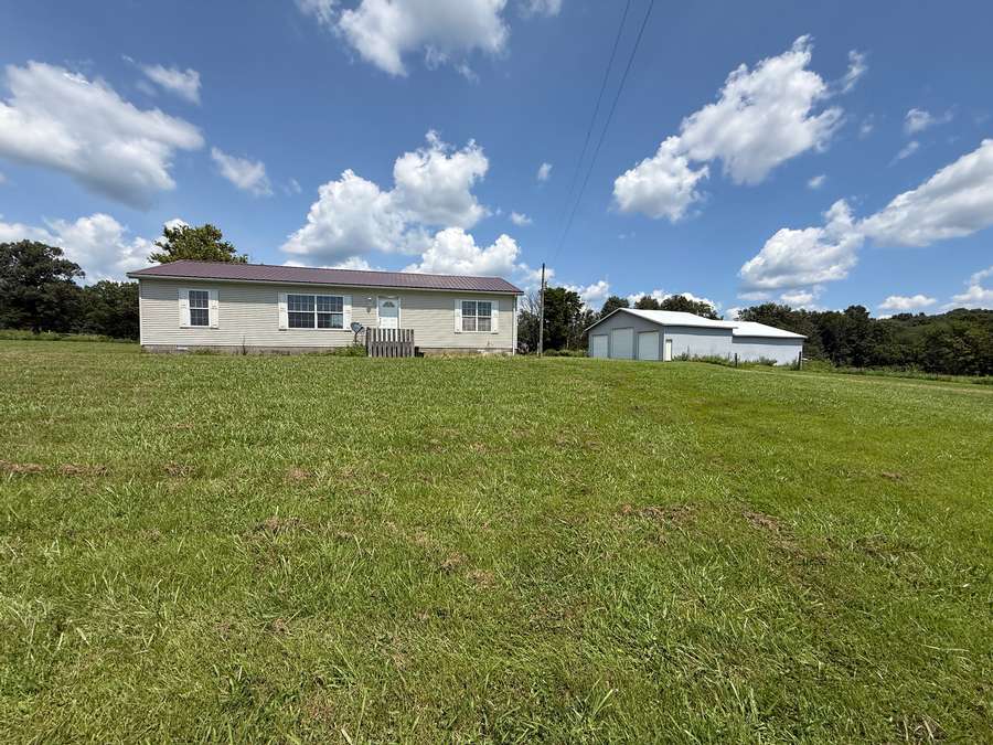 82 Acres +/- 3 Bedroom 2 Bath Home Workshop and Livestock Area with Stalls